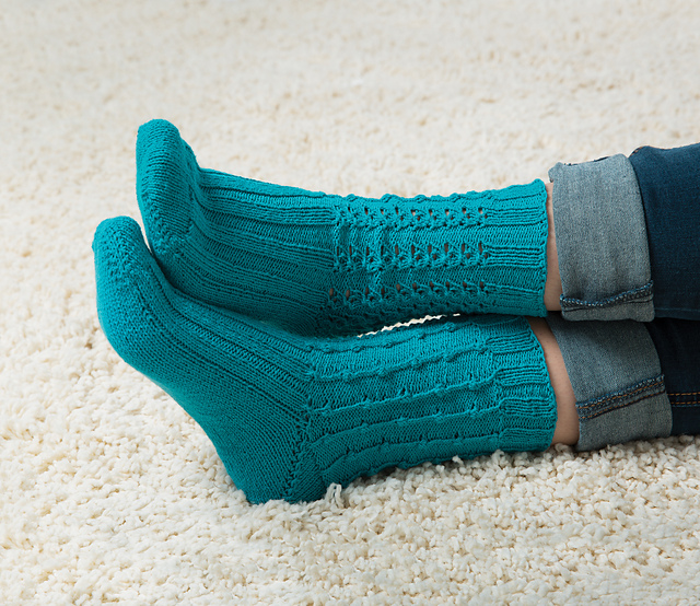 image of indecision socks featuring two different knitting stitch patterns
